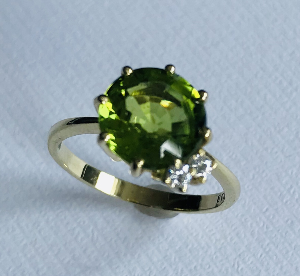 Perydot Ring rund 0,08 ct Brill.